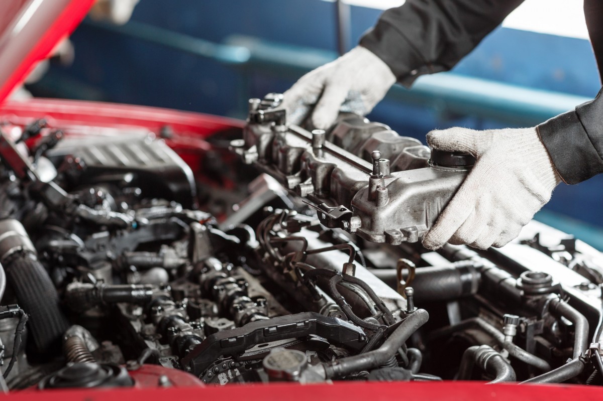 mechanic repairing diesel engine