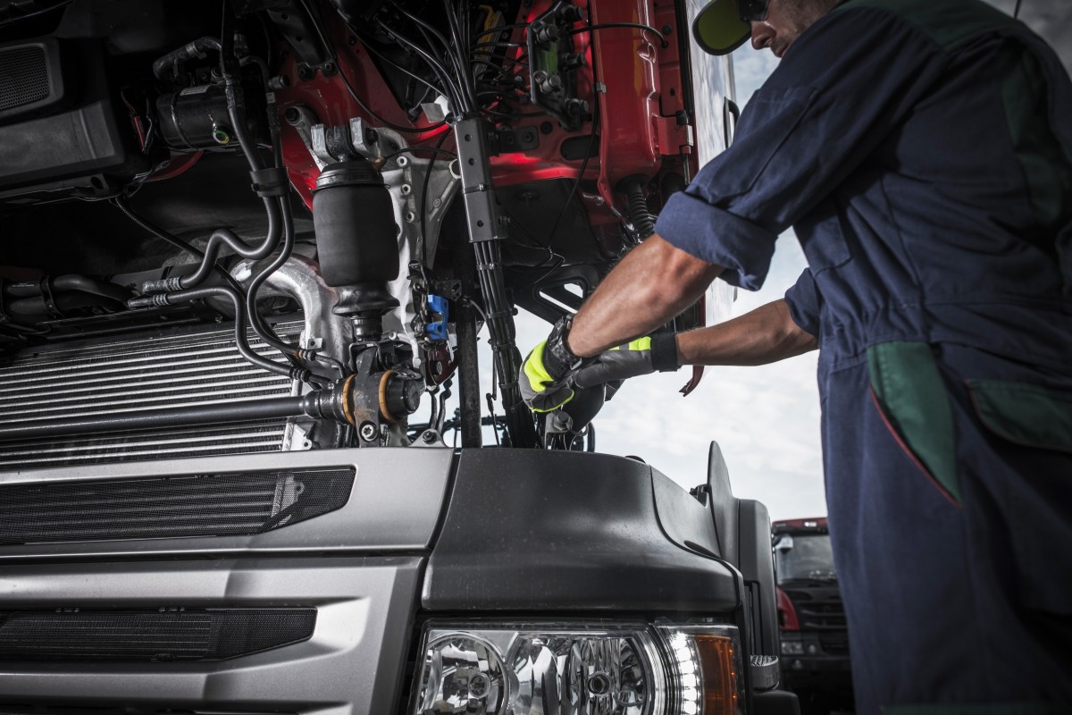 mechanic working on car 